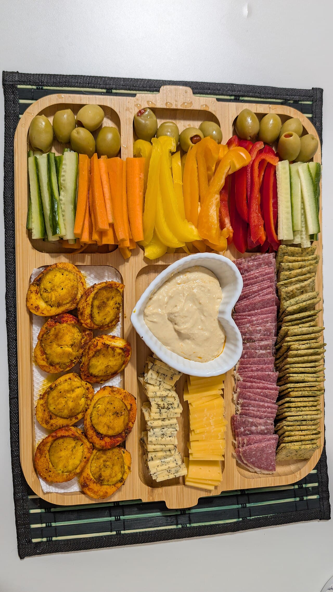 Charcuterie board with cheese, meats and crackers